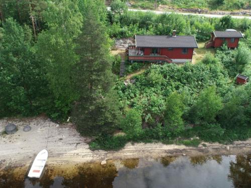an aerial view of a house next to a river at Holiday Home Midtholmen by Interhome in Konsmo