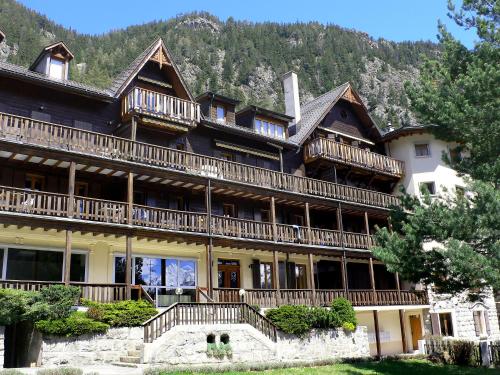 a large house with balconies on the side of it at Apartment Résidence 25 by Interhome in Champex