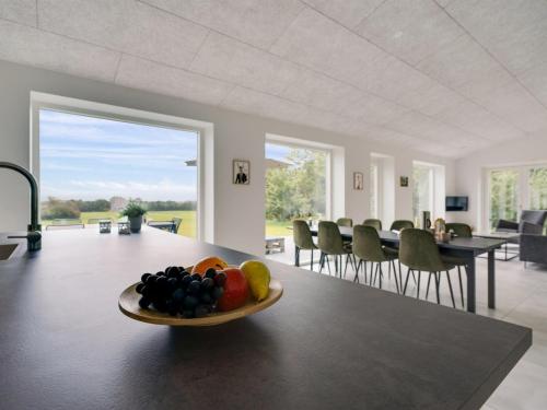 a bowl of fruit on a table in a room at Holiday Home Landuin - 30km from the sea by Interhome in Løgumkloster