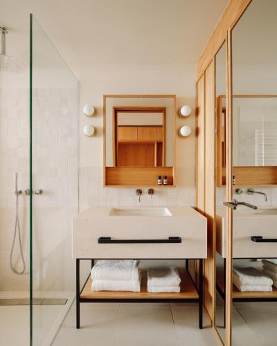 a bathroom with a sink and a shower at Aethos Ericeira in Ericeira