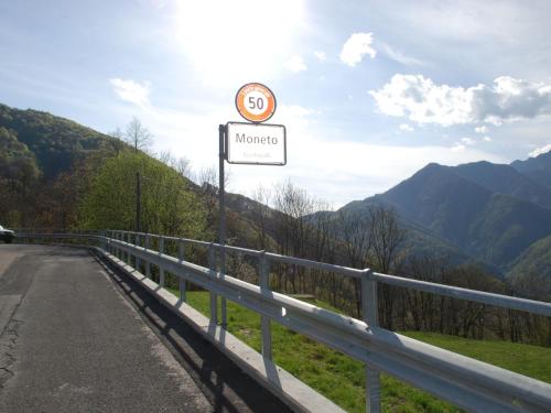 a road sign on the side of a road at Holiday Home Clelia by Interhome in Camedo