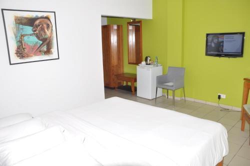 Cama o camas de una habitación en Futuris Hotel