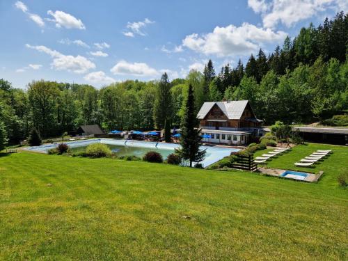 an aerial view of a house with a large yard at Chalet Luxe Timber Lodge & Pet Retreat by Interhome in Mladé Buky