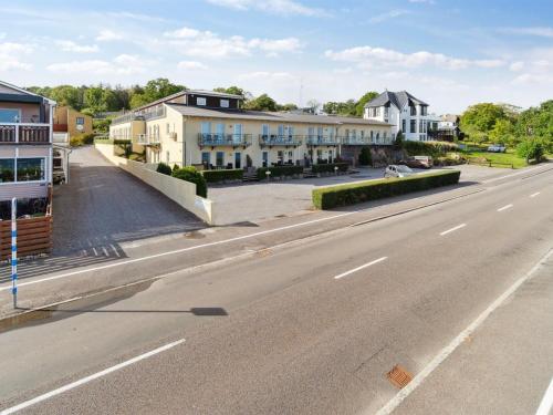 an empty street with houses on the side of a road at Apartment Caisa - 75m from the sea in Bornholm by Interhome in Allinge