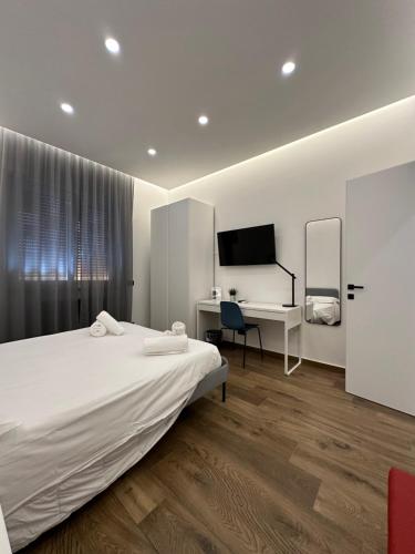 Ένα ή περισσότερα κρεβάτια σε δωμάτιο στο BorgiaRooms Luxury Apartment