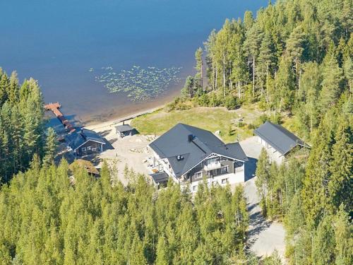 an aerial view of a house on a hill next to a beach at Holiday Home Villa keidas by Interhome in Pertunmaa