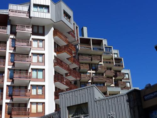 a tall apartment building with balconies on it at Apartment Le Curling B - Val Claret-41 by Interhome in Tignes