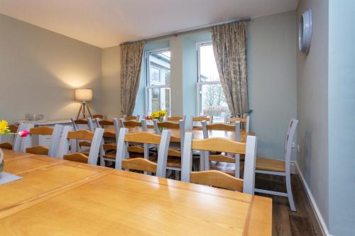 a dining room with a table and chairs at Howgills House Hotel in Sedbergh