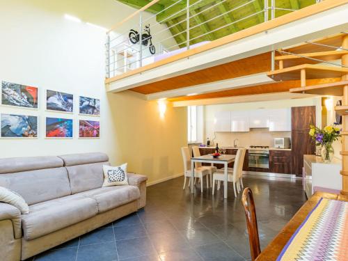 a living room with a couch and a table at Apartment Baby by Interhome in Bellano
