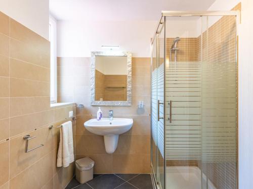 a bathroom with a sink and a shower at Apartment Baby by Interhome in Bellano