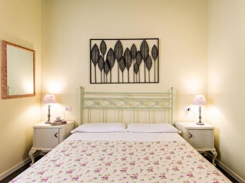 a bedroom with a large bed with two night stands at Apartment Baby by Interhome in Bellano