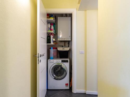 a laundry room with a washer and dryer at Apartment Baby by Interhome in Bellano