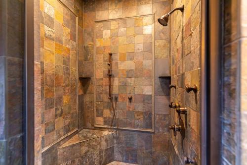 a bathroom with a shower with a glass door at Overlook Estate in The Farm in Banner Elk
