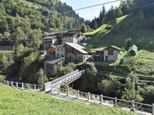 a small village on a hill with a bridge at Apartment La Casetta di Biorca by Interhome in Tartano