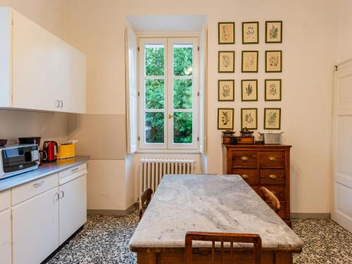 a kitchen with a table and a window at Villa Eugenia by Interhome in Dervio