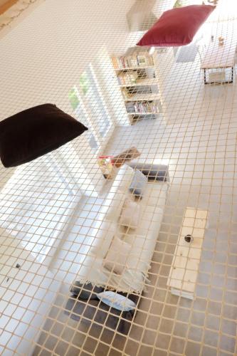 a room with a table and chairs on a tiled floor at Milo Agriproduction in Milo