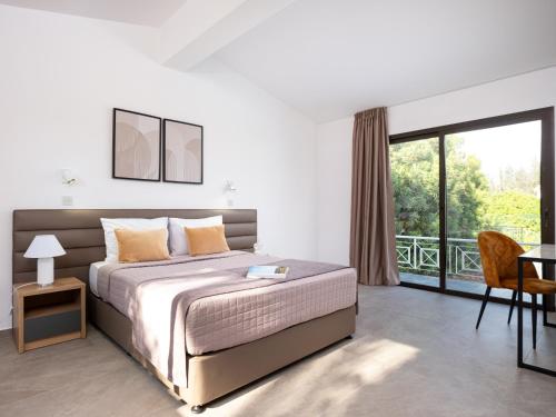 a bedroom with a bed and a large window at Cocoon Ocean Villa Luxury Escape in Peyia