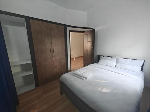 Katil atau katil-katil dalam bilik di Downtown Service Apartments