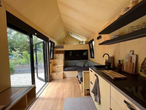 a kitchen and living room of a tiny house at Tiny House zwischen Berlin und Potsdam in Berlin