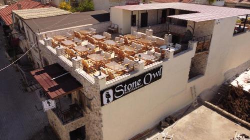an overhead view of a building with a sign on it at Stone Owl Otel & Restaurant in Uchisar