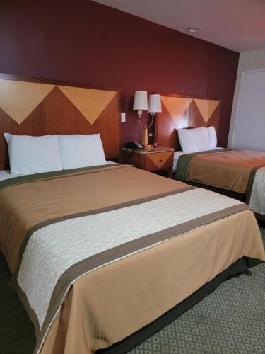Een bed of bedden in een kamer bij M Star Hotel Mansfield