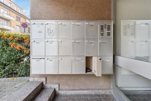 a group of lockers on the side of a building at Beautiful Boutique Apartment DRAHTZUG8 in Zürich