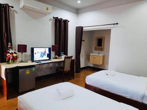 Ένα ή περισσότερα κρεβάτια σε δωμάτιο στο Punyin Hotel Inthanon -ปั้นหยิ่น โฮเทล