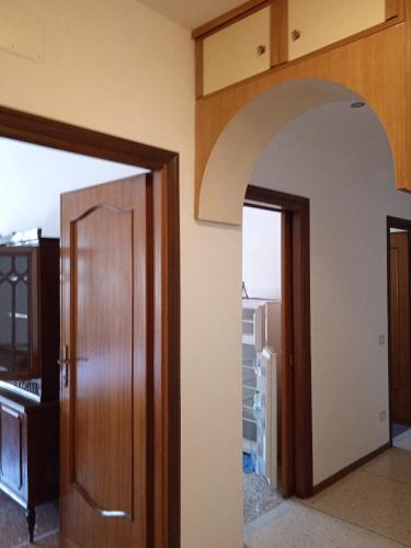 an open door to a room with a refrigerator at A casa di Maria in Rome