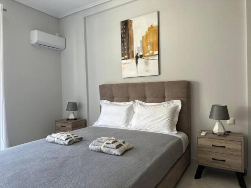 a bedroom with a large bed with two night stands at Redamancy - PERI009 in Athens
