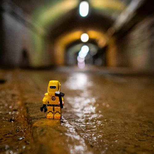 a lego figure standing on a wet street at Der Wolfshof - Dein Zuhause im Harz in Langelsheim