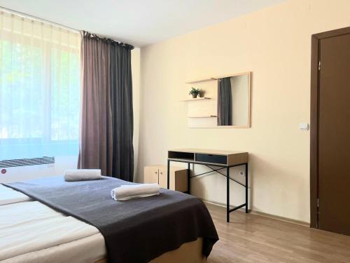 Postel nebo postele na pokoji v ubytování Minkov Apartments, Замъка 2
