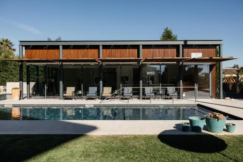 a house with a swimming pool in front of it at Quinta do Eden in Vagos