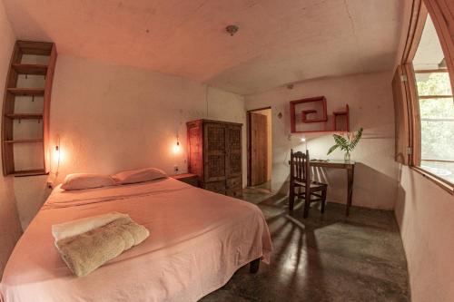 Ένα ή περισσότερα κρεβάτια σε δωμάτιο στο Casa Aquila Mazunte
