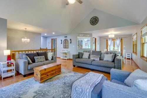 a living room with two couches and a table at Hot Tub, Deck and Game Room Spacious Poconos Escape in Stroudsburg