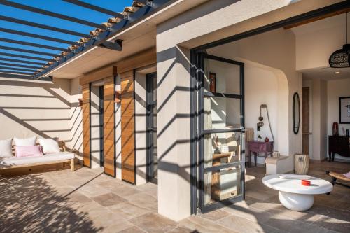 a room with a patio with a glass door at LA BASTIDE DES CULS-ROUSSET in Marseille