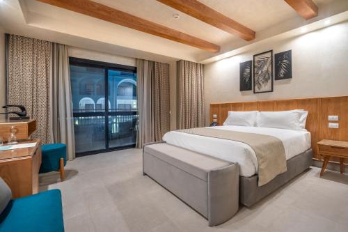 Кровать или кровати в номере Al Masa Hotel El Sokhna