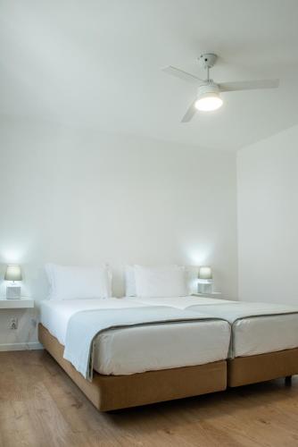 Postel nebo postele na pokoji v ubytování Raminhos Guest House