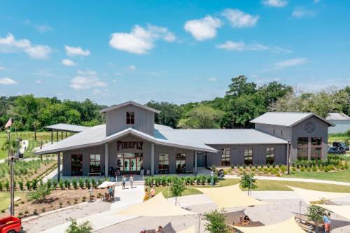 a rendering of a building with people outside of it at Olde Village Loft - Unique Park Circle Experience in Charleston