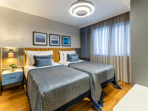 Postel nebo postele na pokoji v ubytování Arum Barut Collection - Ultra All Inclusive