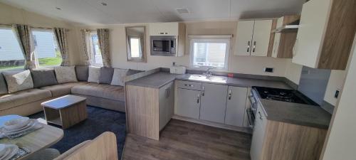 a small kitchen and living room in a caravan at 123 Barmouth bay in Barmouth