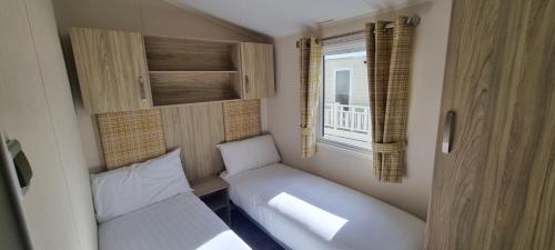 a small room with a bed and a window at 123 Barmouth bay in Barmouth