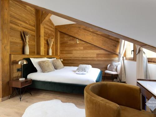 a bedroom with a bed in a room with wooden walls at Appartement Courchevel, 5 pièces, 8 personnes - FR-1-664-21 in Courchevel