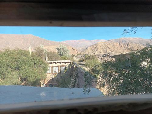 a view from a window of a mountain view at Reposo del Huasamayo in Tilcara