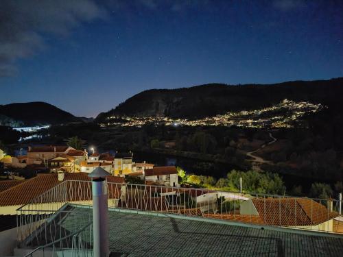 a view from the roof of a house at night at Casinha da Ladeira 3360 in Penacova