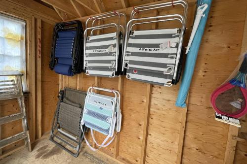 a room with a wall with a bunch of equipment at A Wave from it All: Swift's Beach Wareham in Wareham
