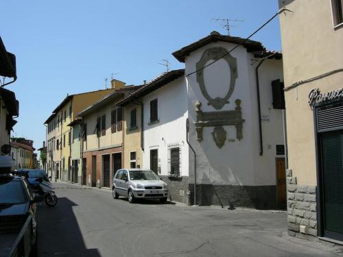 a car parked on the side of a street with buildings at Zoroastrohome Borgo Peretola Firenze Nord in Florence