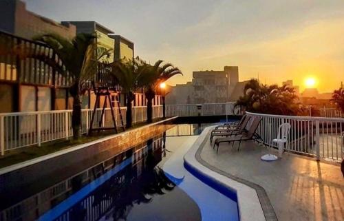 a balcony of a building with a swimming pool at Lapinha 40 Graus Studio in Rio de Janeiro