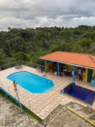 an overhead view of a swimming pool next to a house at Residencial Sítio Paraíso in Itacaré