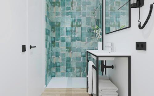 a bathroom with a sink and a shower at Copaiba by Honne Hotels in Playa de Palma