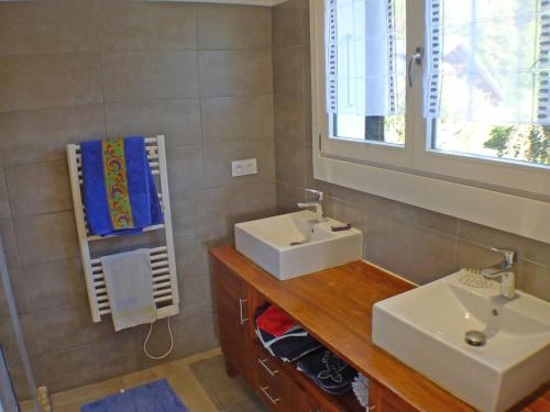 a bathroom with two sinks and a mirror at Chalet Samoëns, 5 pièces, 10 personnes - FR-1-629-88 in Samoëns